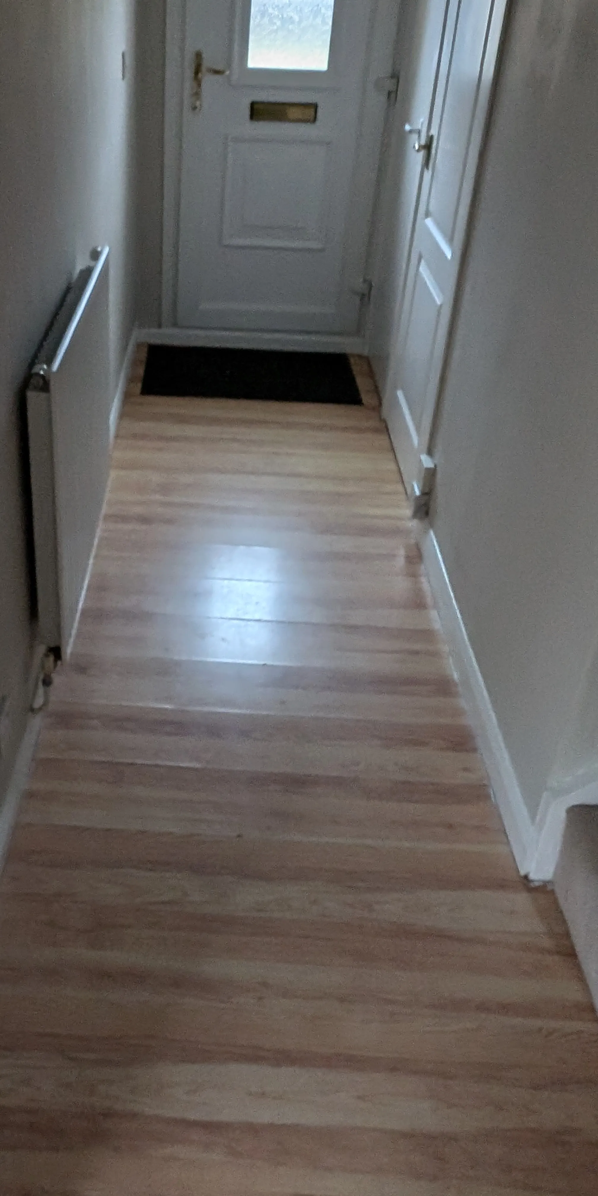 a corridor before floor replacement