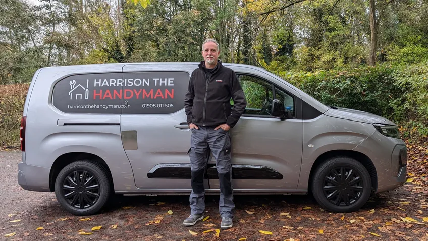 Paul standing by the Harrison the Handyman van